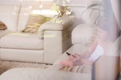 http://www.freedigitalphotos.net/images/On_The_Phone_g371-Young_Girl_Sitting_In_A_Sofa_And_Using_Phone_Behind_The_Glass_Window_p33951.html